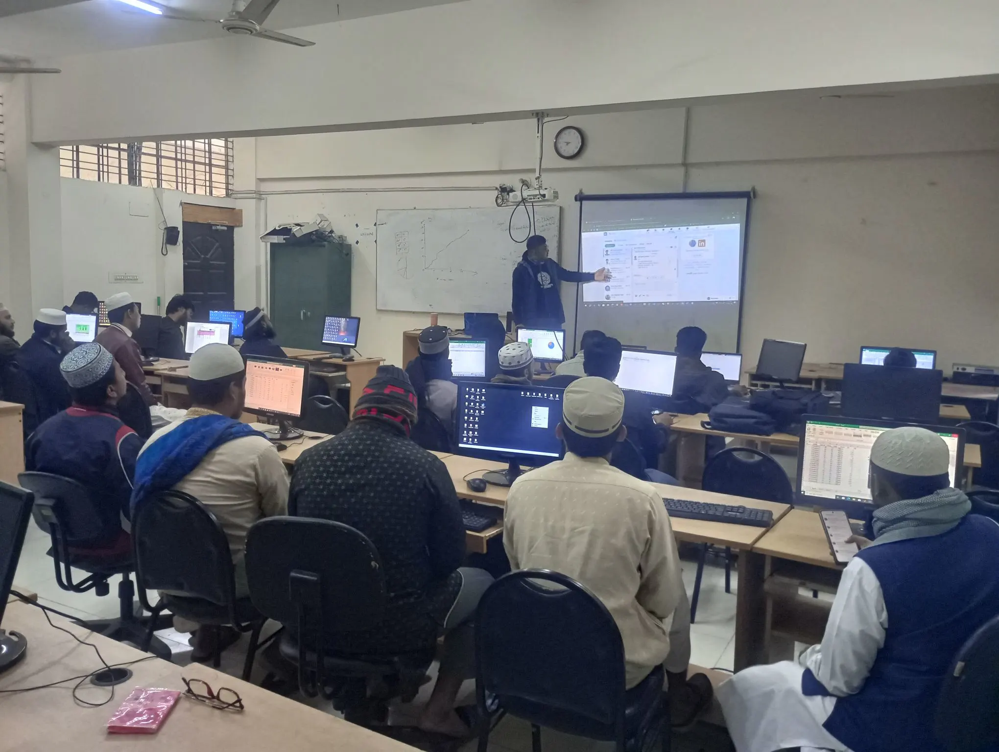 Students practicing advanced spreadsheet formulas during IT training